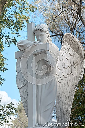 Tomb sculpture of white angel Stock Photo