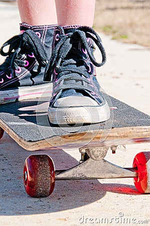 Tomboy on skateboard Stock Photo