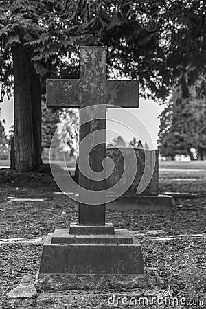 Tombstone and graves in graveyard landscape,black and white. Stock Photo