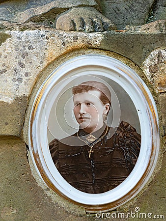 Tombstone with picture of nice young lady deid in 19th century Editorial Stock Photo