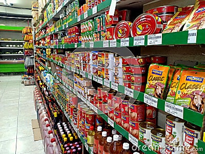 Various kind of food canned displayed on racks Editorial Stock Photo