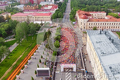 Tomsk, Russia - June 9, 2019: International Marathon Jarche athletes runners crowd are at start. Aerial top view Editorial Stock Photo
