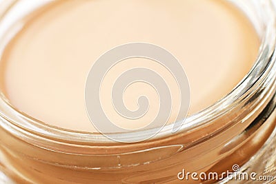 Tonal cream closeup in glass jar Stock Photo