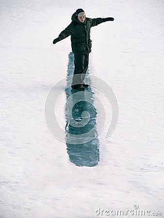 Toned image child to ride on an ice hill standing on their feet Stock Photo