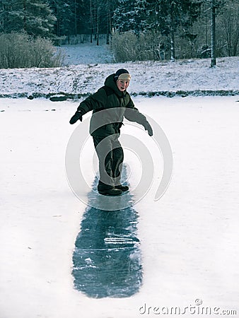 Toned image child to ride on an ice hill standing on their feet Stock Photo