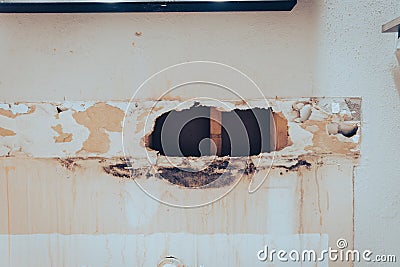 Toned photo broken drywall in bathroom with water damaged, mold, mildew on surface of residential house in Texas, US Stock Photo