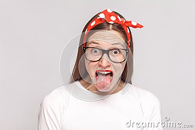 Tongue out of surprised, or shocked crazy emotional young woman Stock Photo