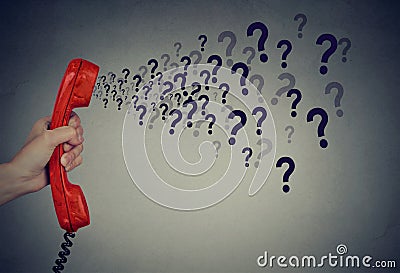 Too many questions over the phone Stock Photo