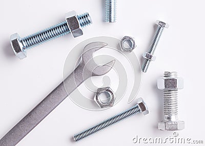 The tool is a mechanic. Bolts, nuts and wrench closeup Stock Photo