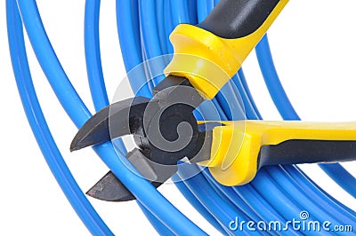 Tool pliers cutting blue cable Stock Photo