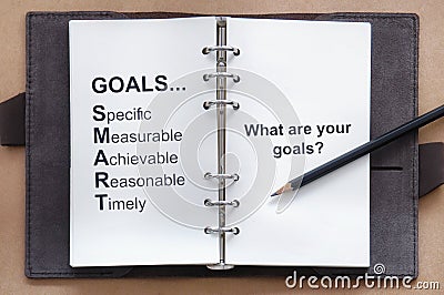 Tool of setting goal and what are your goals words on organizer book with pencil Stock Photo