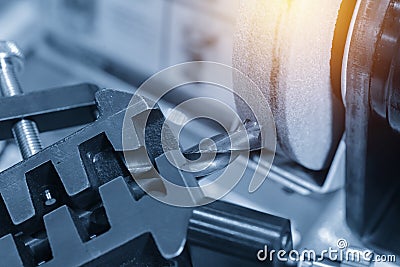 The tool sharpening machine operate in light blue scene Stock Photo