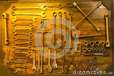 Tool storage on wooden wall in the shop Stock Photo