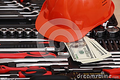 Toolbox, tools kit detail, dollar bills and orange protective helmet close up. instruments. set of tools. car tool kit. tool set Stock Photo