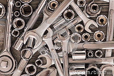 Tools, adjustable wrench, socket wrench, Sockets on wood background, top view, flat lay Stock Photo