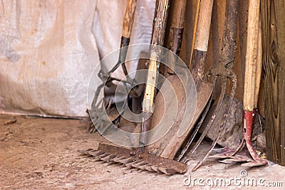 Tools for agriculture are rustic garage, shovel, rake and the other garden items Stock Photo