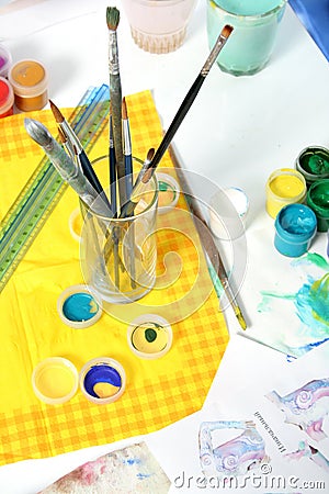 Tools of the artist: paints, brushes and a paper Stock Photo