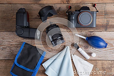 Tools for cleaning camera with dslr camera and lens, flash. Stock Photo