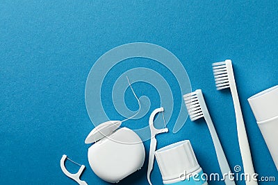 Tools for dental care on blue background Stock Photo