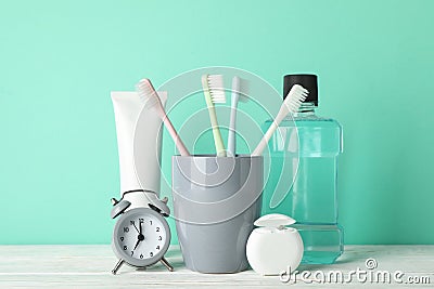 Tools for dental care on mint background Stock Photo