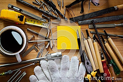 Tools equipment with coffee and notepad on wood Stock Photo