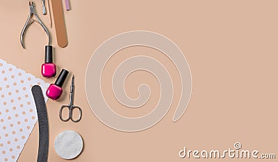 Tools for manicure on a beige background. Nail files, scissors and nail polishes top view. Nail salon, salon at home Stock Photo
