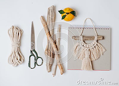 Tools and materials for macrame weaving over white surface Stock Photo