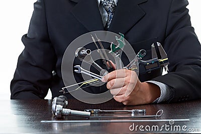 Tools and mechanical engineer working by holding many kind of tooling Stock Photo