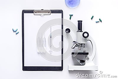 Tools for medical tests microscope, Petri dish, ampoule on white background top view Stock Photo