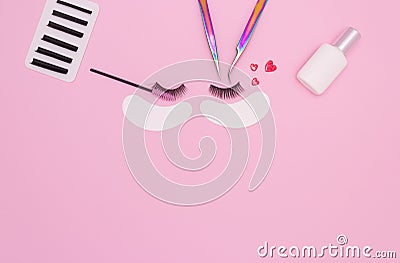 Tools and patches for eyelash extensions and artificial eyelashes on a pink background. Tools for the lashmaker. The view from the Stock Photo