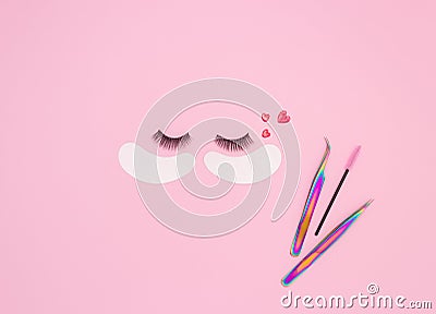 Tools and patches for eyelash extensions and artificial eyelashes on a pink background. Tools for the lashmaker. The view from the Stock Photo