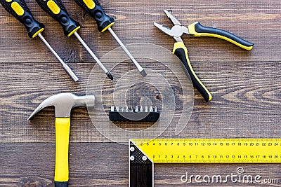 Tools for repairing on wooden desk background top view Stock Photo
