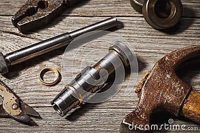 Tools for stretching rings of gold on a wooden table Stock Photo