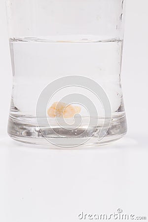 Tooth decay in a glass of water Stock Photo