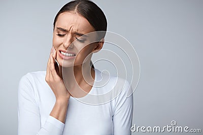 Tooth Pain. Beautiful Woman Feeling Strong Pain, Toothache Stock Photo