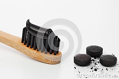 Toothbrush with black charcoal toothpaste Stock Photo