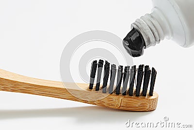 Toothbrush with black charcoal toothpaste Stock Photo