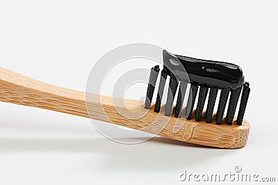 Toothbrush with black charcoal toothpaste Stock Photo
