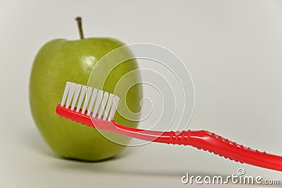 Toothbrush and green apple, dental care concept Stock Photo