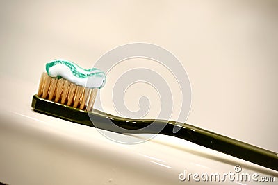 toothbrush with toothpaste in the girl`s hand Stock Photo
