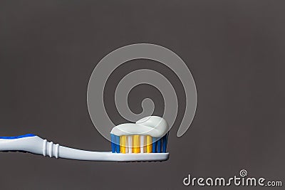 toothbrush with toothpaste isolated on grey background Stock Photo