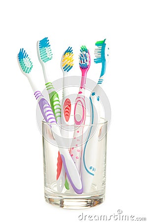 Toothbrushes in glass isolated on white background Stock Photo