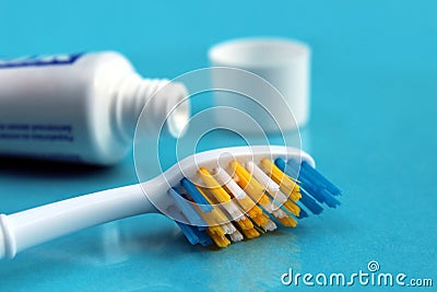 Toothpaste with a brush on a blue background Stock Photo