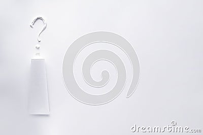Toothpaste in the form of a question mark, on a white background with prostrasnstvom for text, flat lay Stock Photo