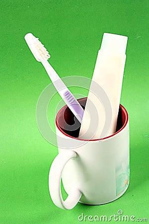 Toothpaste, toothbrush cup Stock Photo