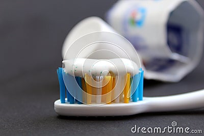 Toothpaste and brushes on a black background Stock Photo