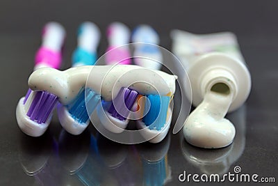 Toothpaste and brushes on a black background Stock Photo