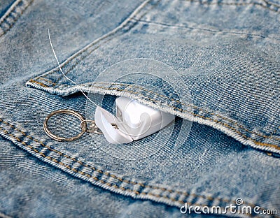 Toothpick thread in a jeans pocket. Dental care concept Stock Photo