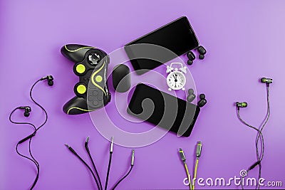 A toothy Smart Fish from gadgets devours time on a purple background Stock Photo