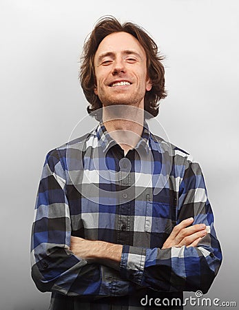 Toothy smiling caucasian man in causal shirt isolated Stock Photo